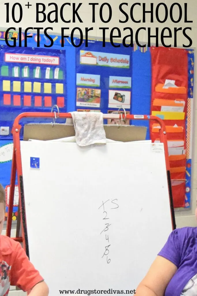 Photo of a dry erase easel in a classroom with the words "10+ Back To School Gifts For Teachers" digitally written on top.