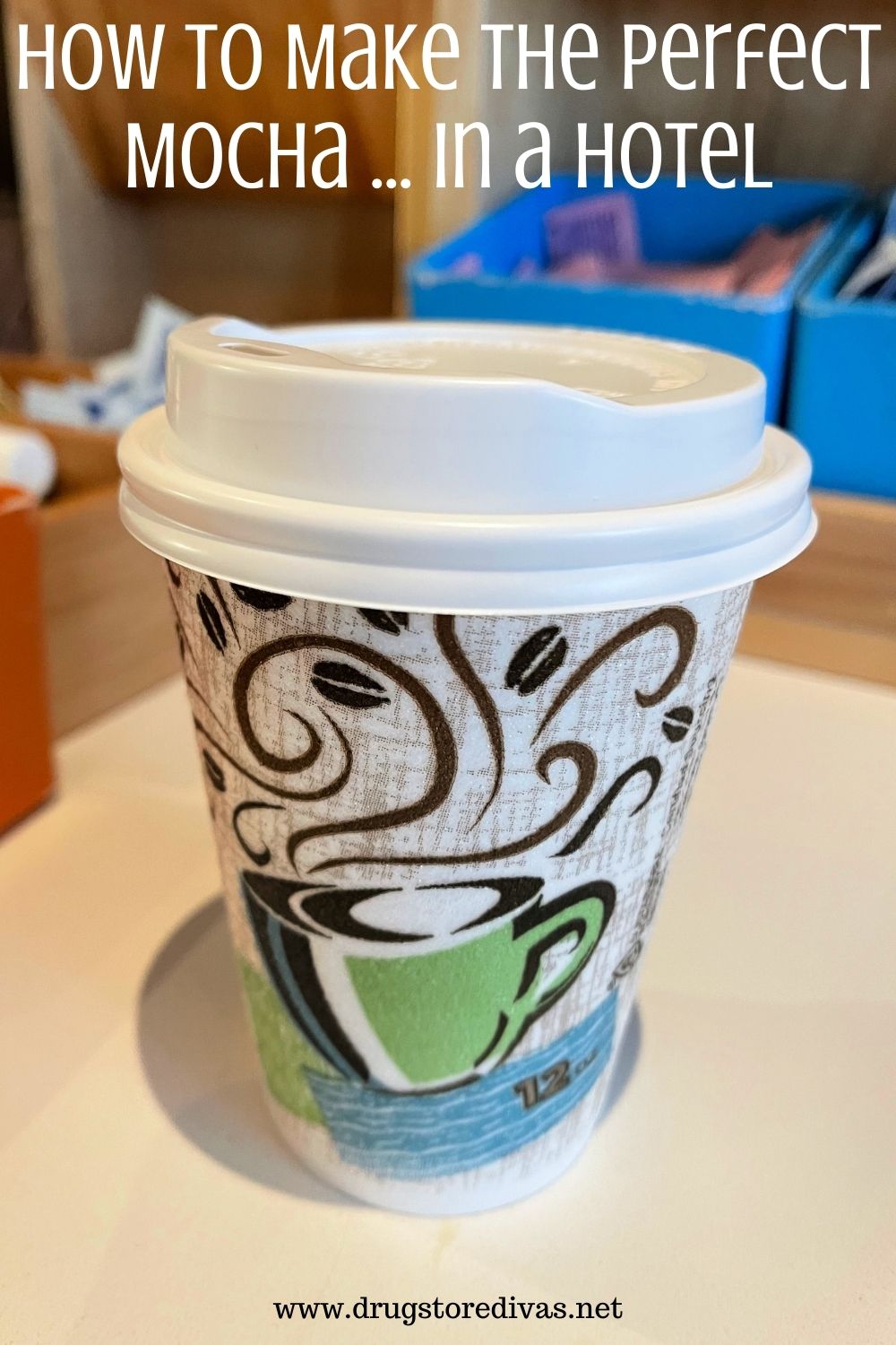 Hot coffee cup with a lid on at a coffee bar in a hotel.