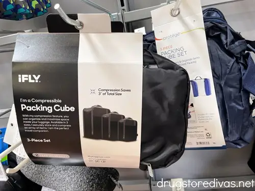 Packages of packing cubes on a hang pin in a store.