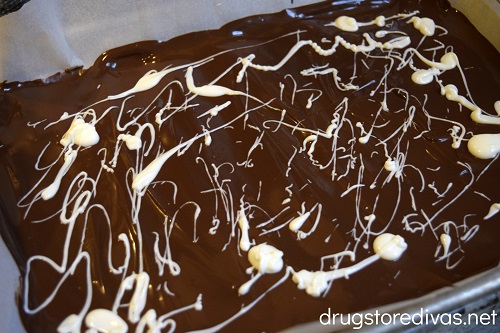 Milk and dark chocolate melted on a cookie sheet.