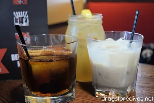 Three mixed drinks on a table.