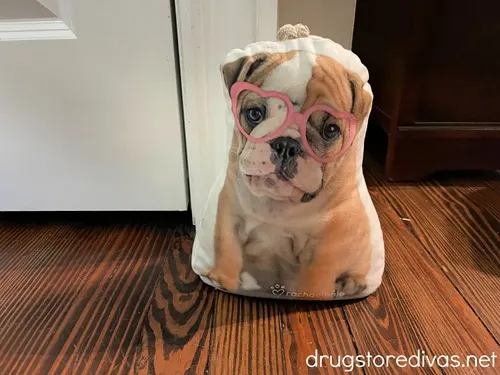 A cut out pillow with a dog photo on it.