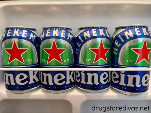 Four cans of Heineken 0.0 beer in a fridge.