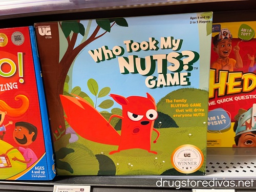 A board game called Who Took My Nuts Game on a shelf in a store.