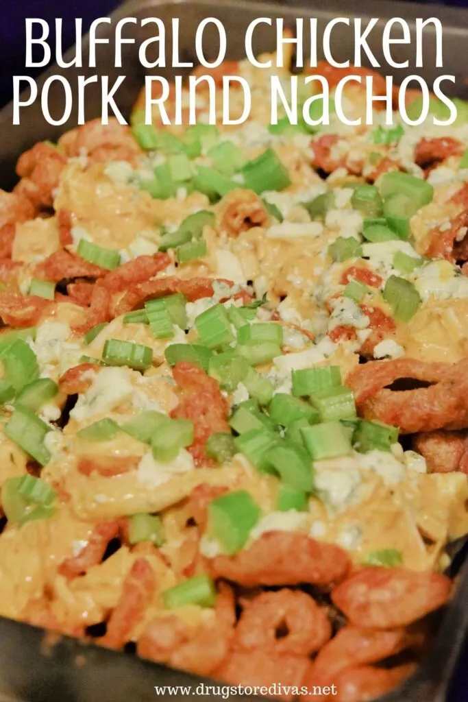 Buffalo Chicken Nachos in a pan with the words "Buffalo Chicken Pork Rind Nachos" digitally written above it.