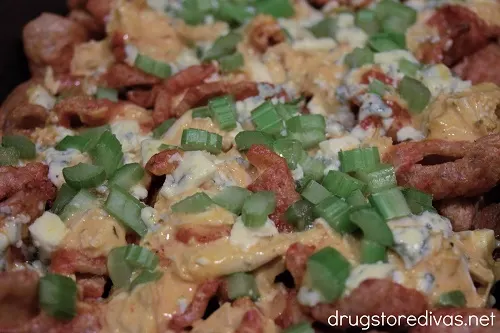 Buffalo Chicken Pork Rind Nachos in a cake pan.