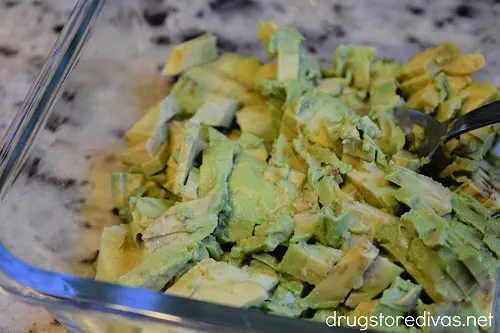 Avocado chunks in a glass bowl.