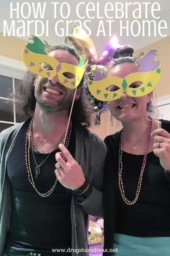 Two people in homemade Mardi Gras masks and beads with the words "How To Celebrate Mardi Gras At Home" digitally written above them.