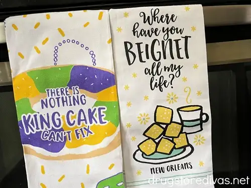 Two Mardi Gras towels in a kitchen.