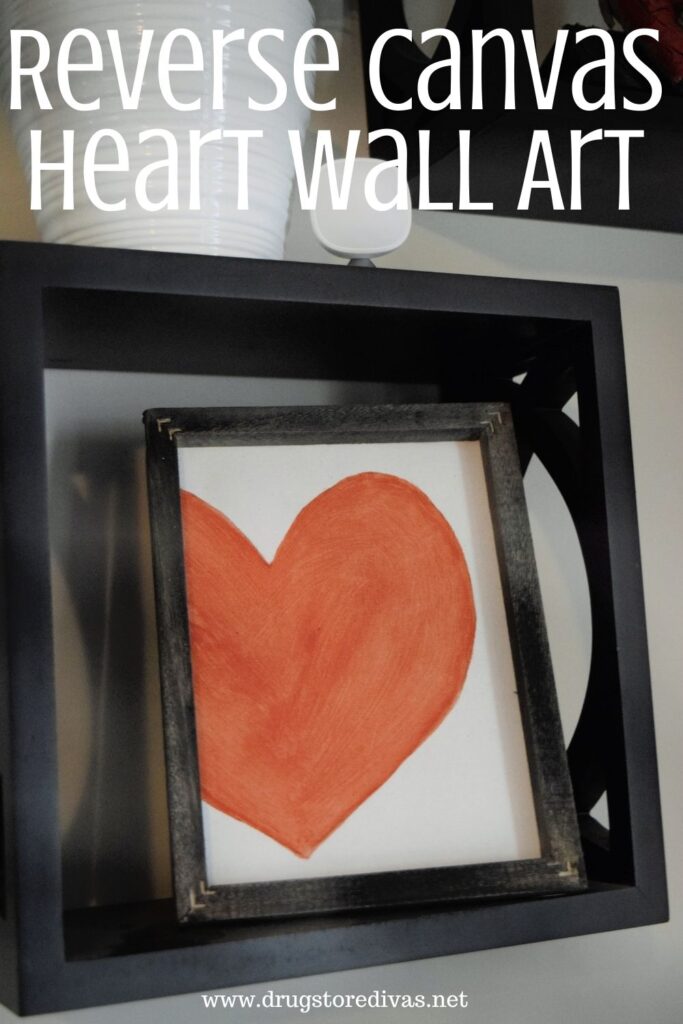 A hand painted piece of wall art with the words "Reverse Canvas Heart Wall Art" digitally written above it.