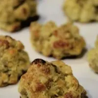 Cornbread sausage balls on a tray with the words 
