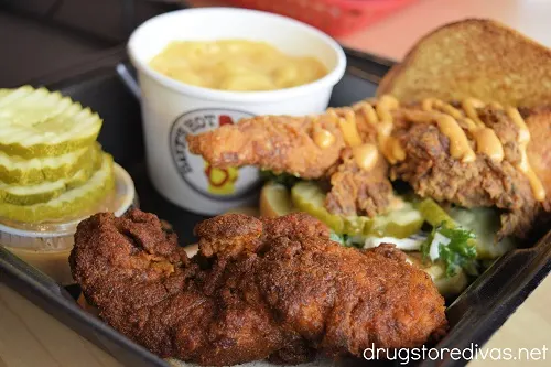 A chicken sandwich, chicken tenders, pickles, and macaroni and cheese from Dave's Hot Chicken.