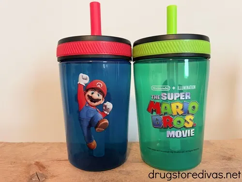 Two Super Mario toddler cups with straws.