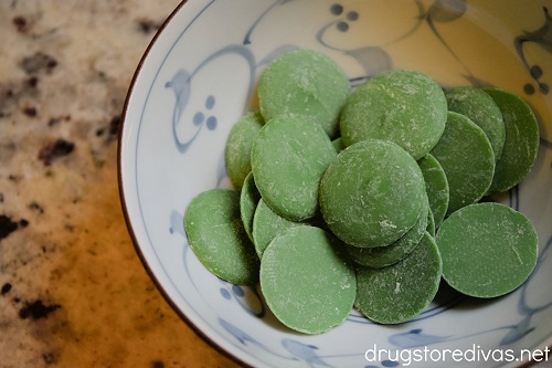 Green candy melts in a bowl.