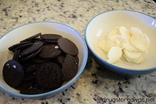 Oreo cookies in a bowl and Oreo cream from the cookies in another bowl.