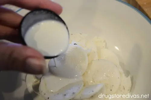 Milk being poured into cream from Oreo cookies.