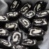 Pieces of Oreo sushi in a bowl with the words 