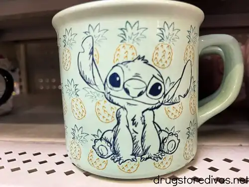 A Stitch animation mug on a shelf in a store.