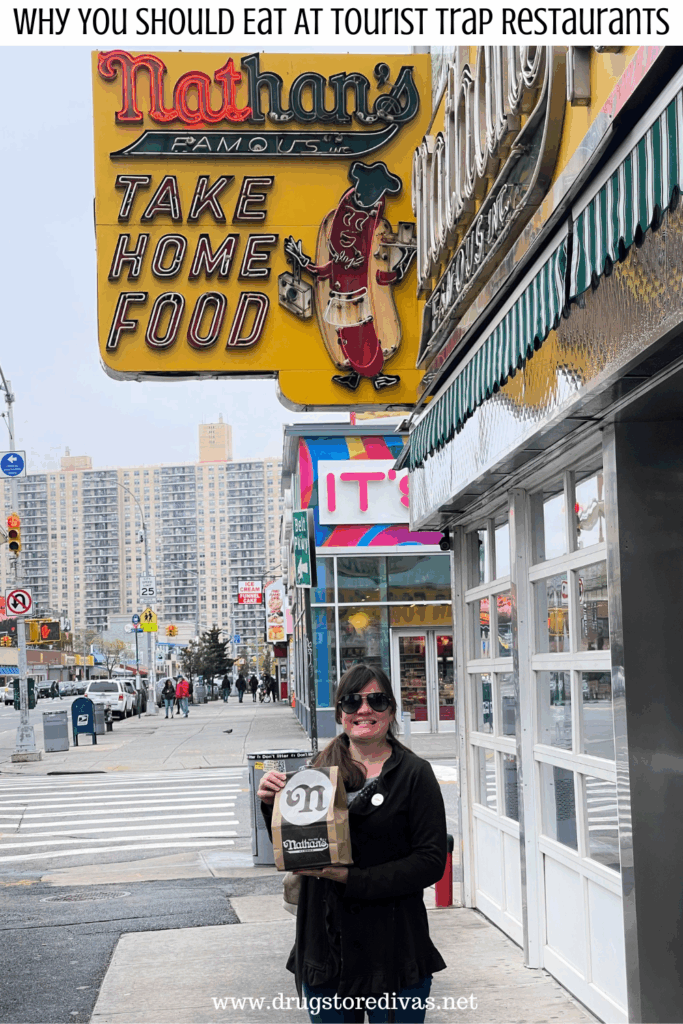 A woman holding a bag in front of the Nathan's Hot Dogs in Coney Island with the words "Why You Should Eat At The Tourist Trap Restaurants" digitally written above her.