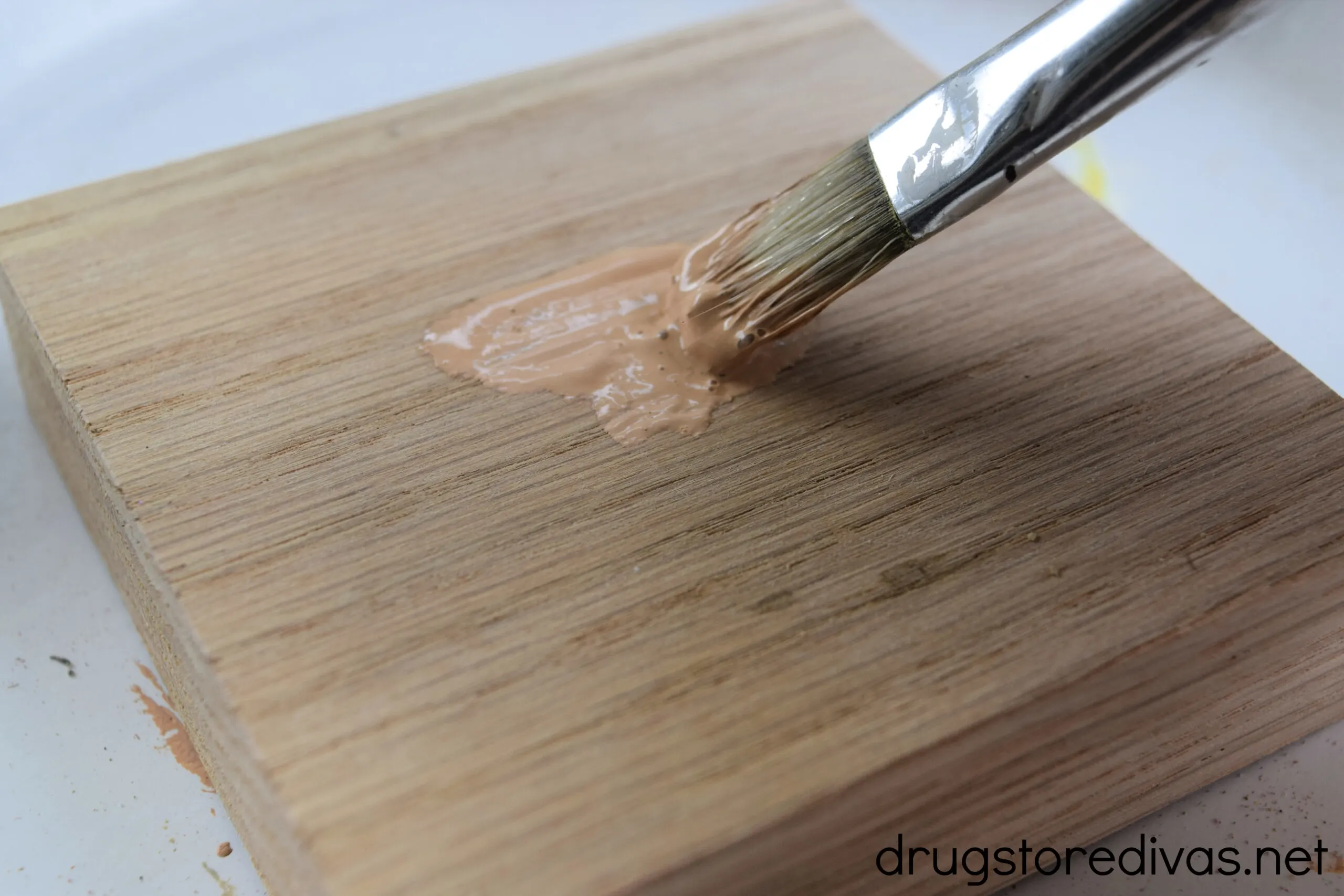 Scrap wood being painted.