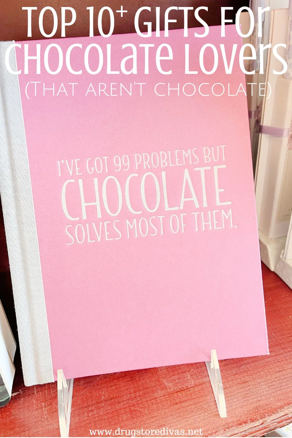 A pink notebook that says 