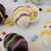 Four homemade smash eggs, surround by candy, and the words 