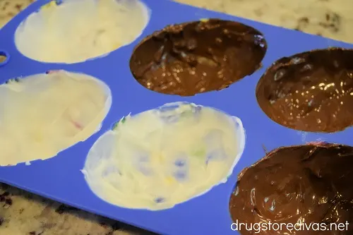 White and dark chocolate in a silicone egg mold.