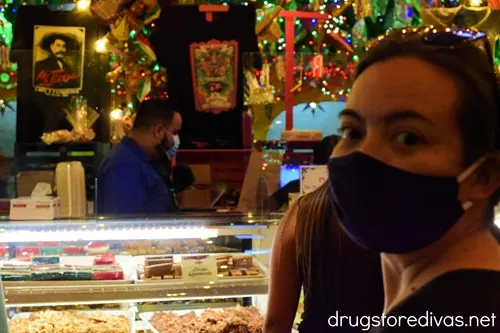 A woman in a mask at the pastry counter at Mi Tierra in San Antonio, Texas.