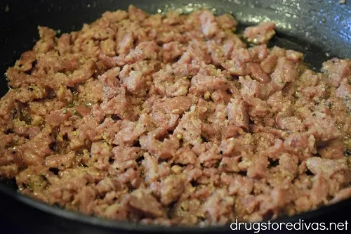 Sausage pieces in a pan.