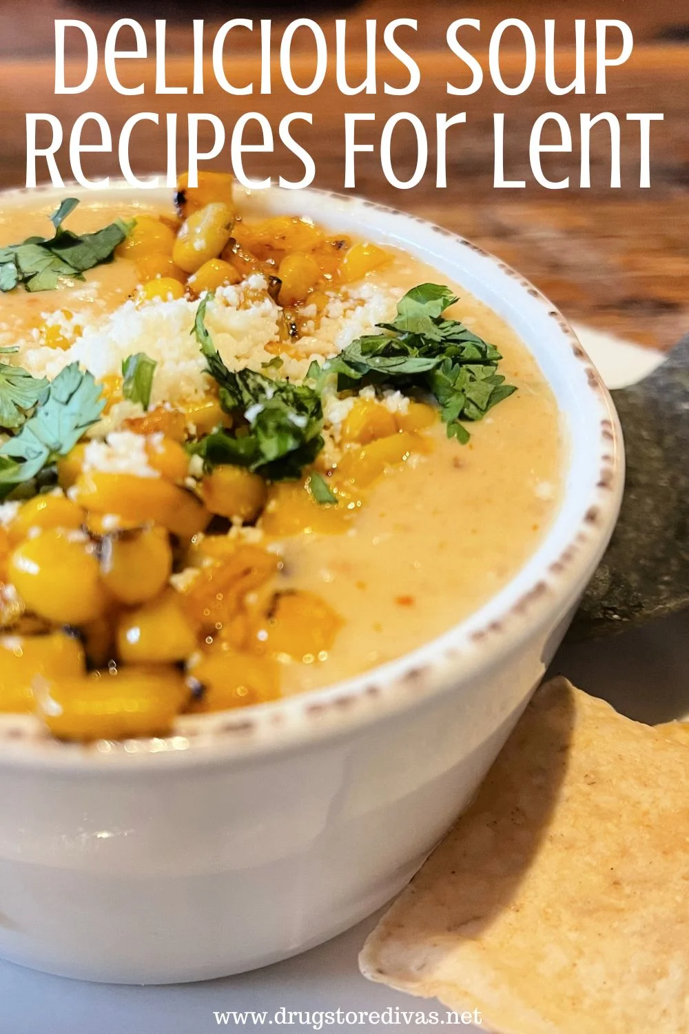 A white bowl of corn chowder next to some tortilla chips with the words 