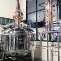 Distilling equipment in a room with the words 