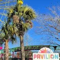 A ferris wheel at the Pavilion at Broadway at the Beach in Myrtle Beach with the words 