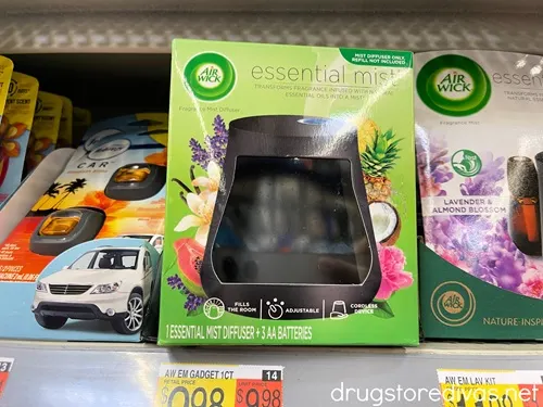 An Air Wick Essential mist diffuser on a shelf.