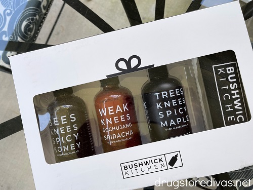 Three bottles of Bushwick Kitchen products.