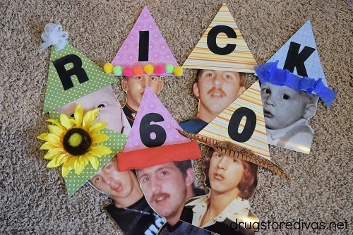 Many scrapbook party hats on top of photo faces.