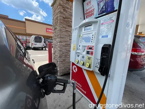 A car getting gas at a gas station.