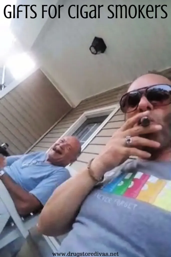 Two men on a porch smoking cigars with the words "Gifts For Cigar Smokers" digitally written on top.