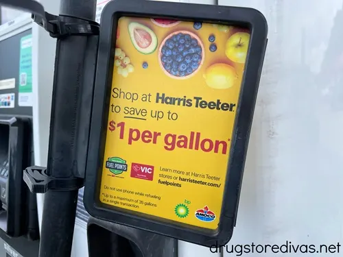 A sign advertising gas savings at Harris Teeter.