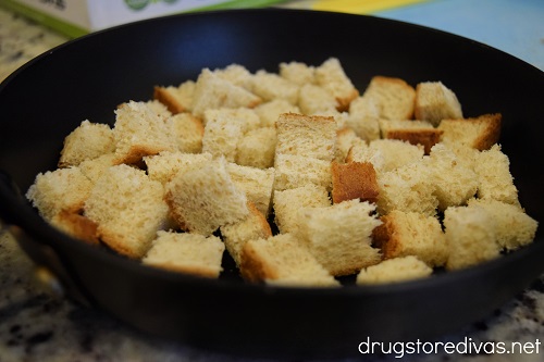 Diced bread in a pan.