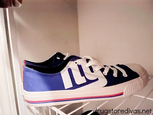 A blue pair of sneakers with the New York Giants logo on them.