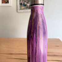 A painted water bottle with the words 