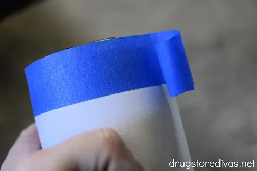 A water bottle wrapped with painter's tape.