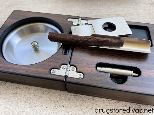 Portable ash tray for cigars.