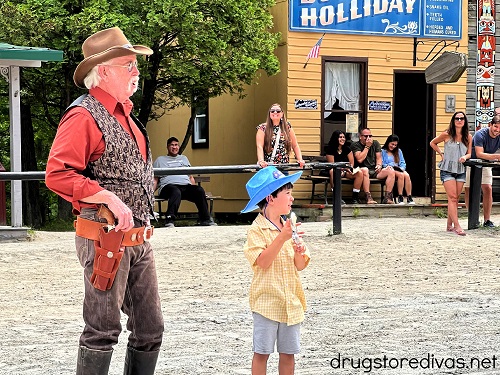 A boy and a performer on stage at Wild West City in Stanhope, NJ.