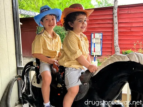 Two boys riding a mechanical horse at Wild West City in Stanhope, NJ.