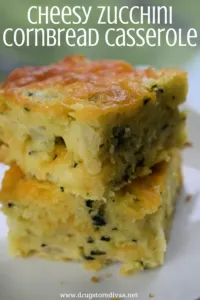 Two pieces of cornbread with the words "Cheesy Zucchini Cornbread Casserole" digitally written on top.