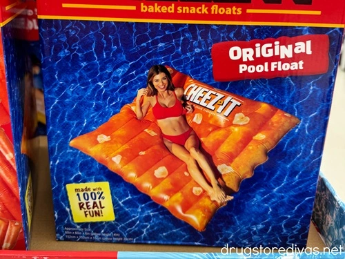A box containing a pool float that's shaped like a Cheez It cracker.