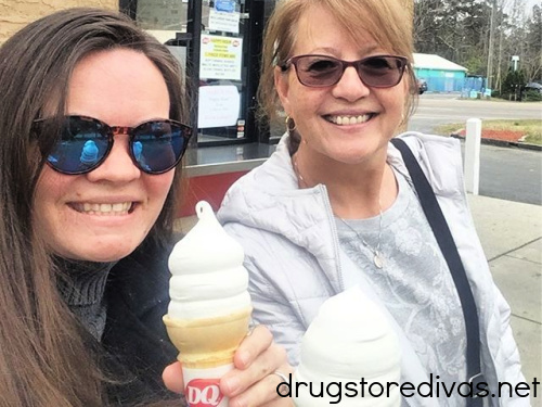 Two women holding ice cream cones in front of Dairy Queen.