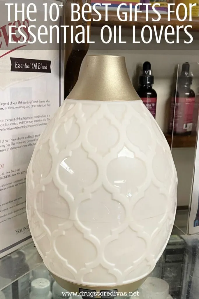 An essential oil diffuser on a counter with the words "The 10+ Best Gifts For Essential Oil Lovers" digitally written on top.