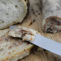 Bread with butter next to it and on it and the words 